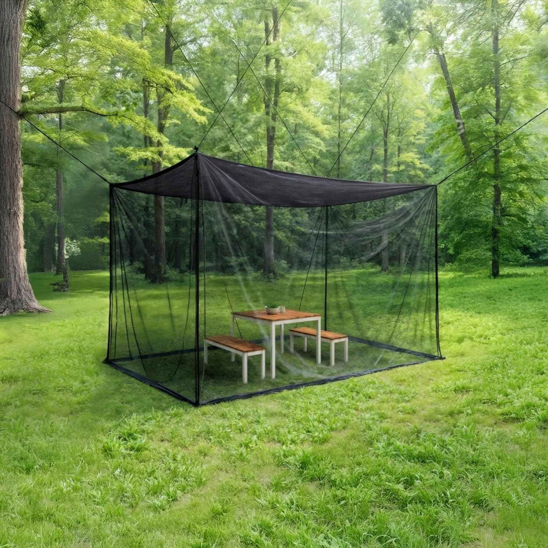 Moskitonetz über Gartentisch: Schwarze Kastenform schützt vor Mücken und Wespen, ideal für entspannte Gartenmomente.